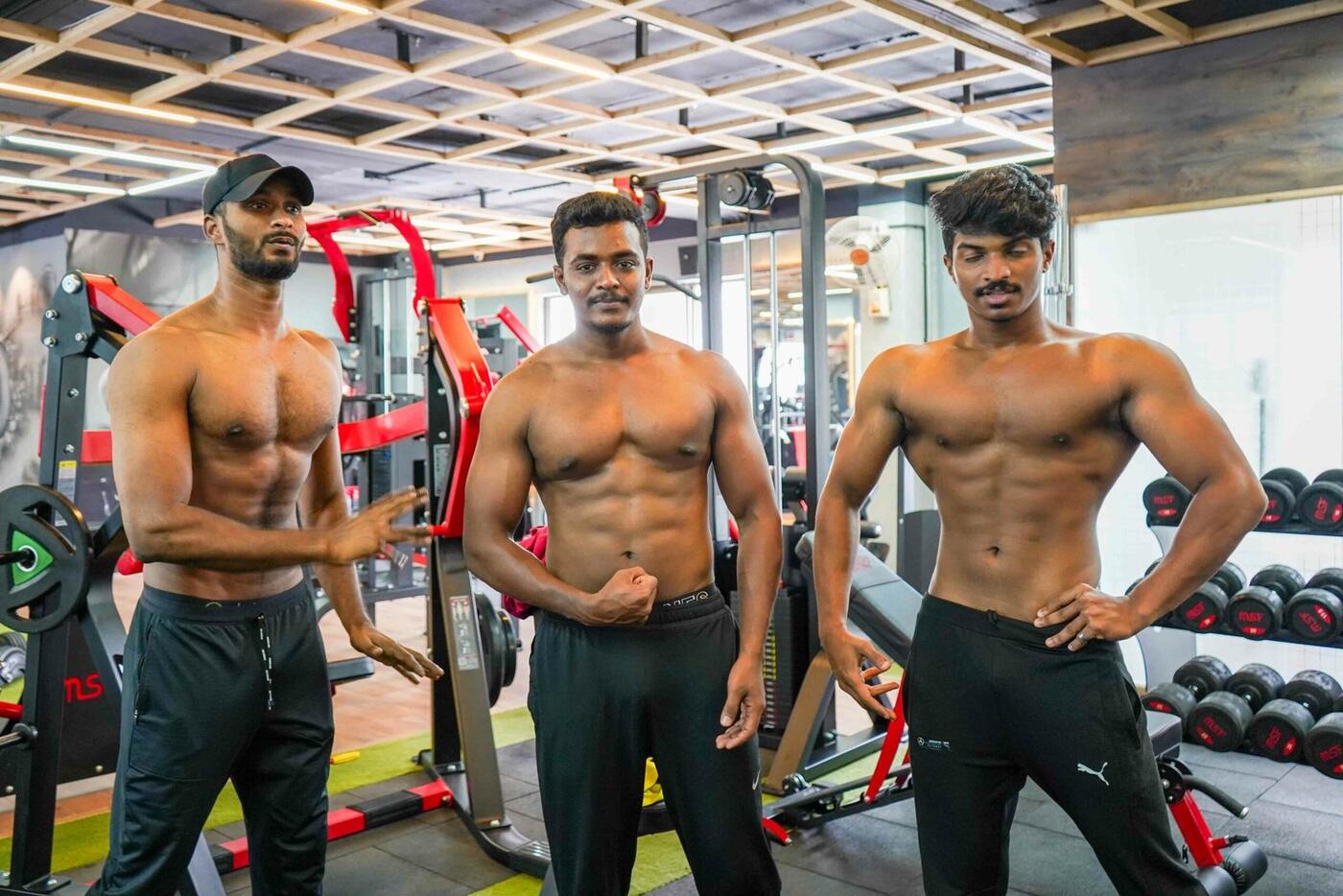 Three Rockwall members flexing together after a session
